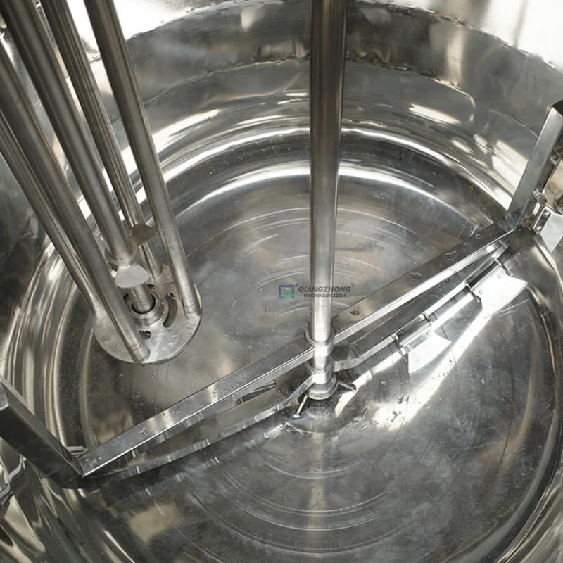 Wall scraping mixing emulsion tank